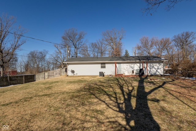 rear view of house with a yard