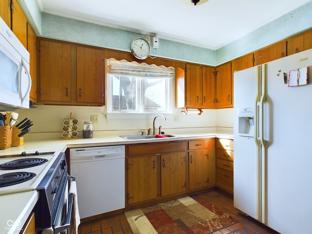 kitchen featuring sink and white appliances