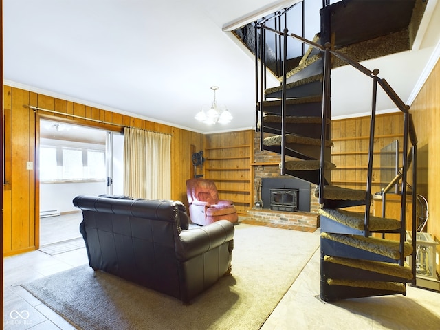 tiled living room featuring crown molding, a wood stove, a baseboard radiator, and wood walls