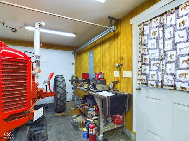 garage featuring wood walls