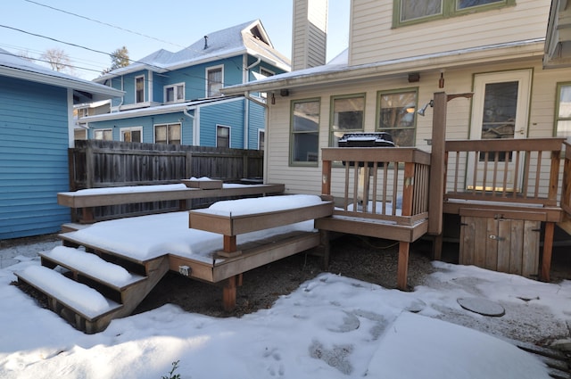 view of snow covered deck