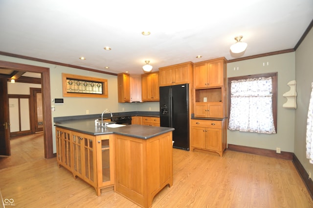 kitchen with crown molding, sink, black refrigerator with ice dispenser, and light hardwood / wood-style flooring