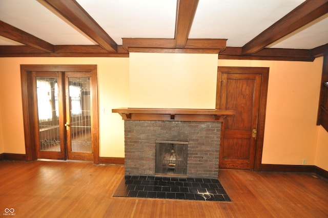 unfurnished living room with hardwood / wood-style flooring and a fireplace