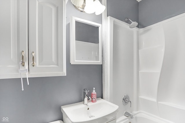 bathroom with shower / bathtub combination and sink