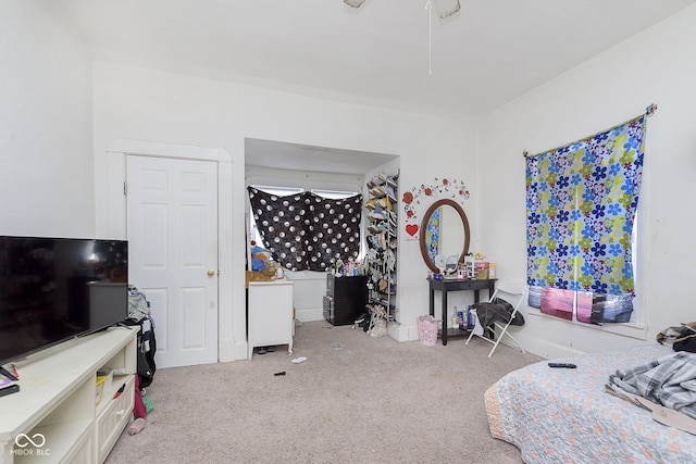 bedroom featuring light colored carpet