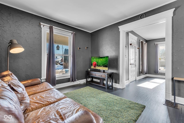 living room with crown molding and dark hardwood / wood-style floors