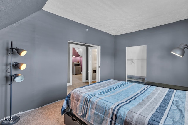 carpeted bedroom with a textured ceiling