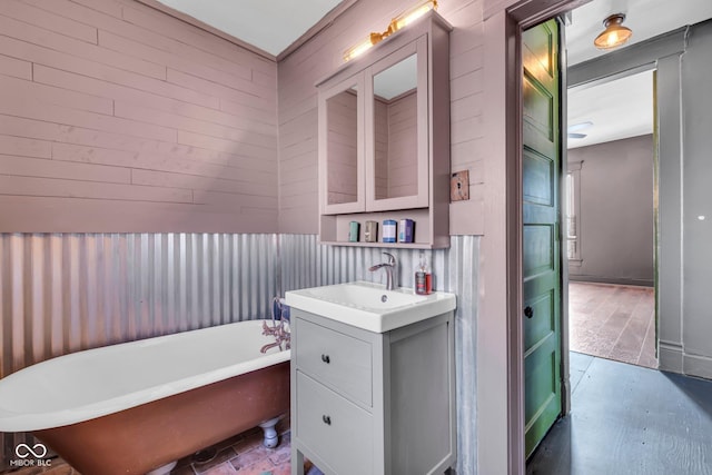 bathroom with vanity and a bathtub