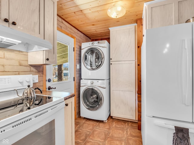 laundry room with wood ceiling, brick wall, and stacked washing maching and dryer