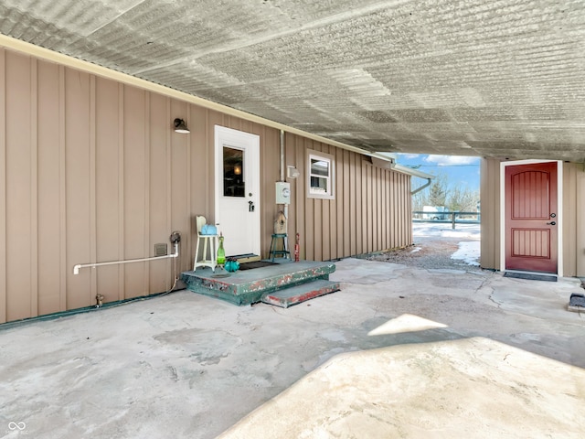 entrance to property with a patio