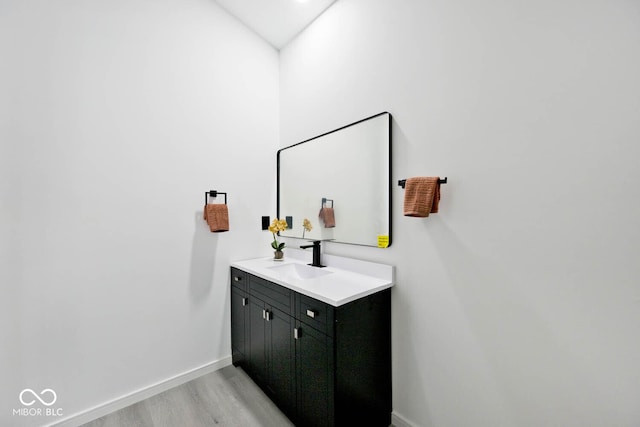 bathroom featuring vanity and hardwood / wood-style floors