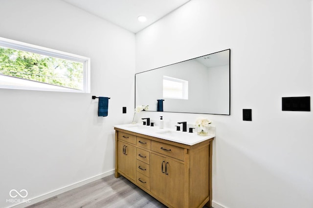 bathroom with vanity and hardwood / wood-style flooring