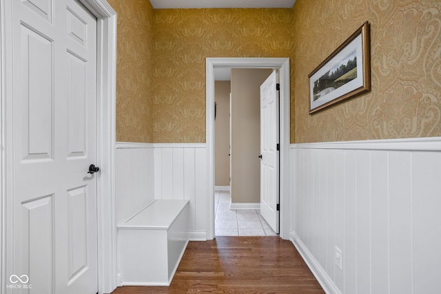 8552 E 550 S, Zionsville, IN 46077 - hall featuring a wainscoted wall, wallpapered walls, and wood finished floors