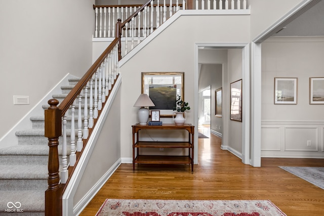 8552 E 550 S, Zionsville, IN 46077 - staircase featuring wood finished floors and a towering ceiling