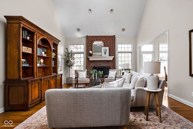8552 E 550 S, Zionsville, IN 46077 - living room featuring a brick fireplace, dark wood-type flooring, and high vaulted ceiling