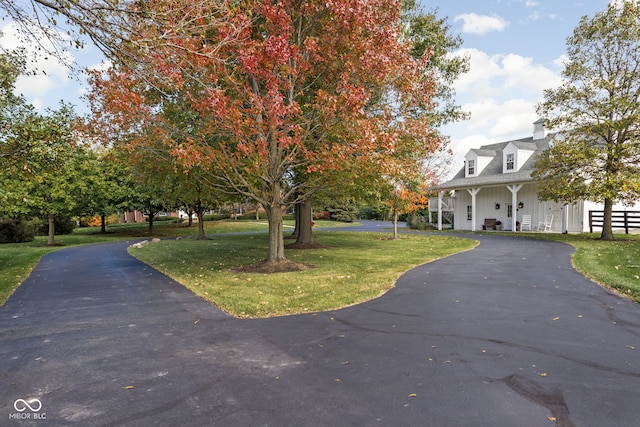 8552 E 550 S, Zionsville, IN 46077 - view of front of house featuring a front yard, board and batten siding, and a chimney