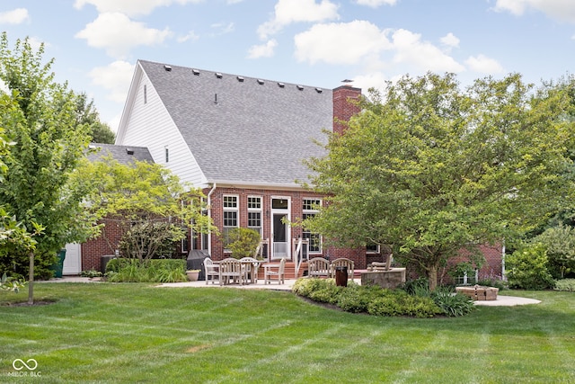 8552 E 550 S, Zionsville, IN 46077 - back of property featuring a patio, roof with shingles, brick siding, a lawn, and a chimney