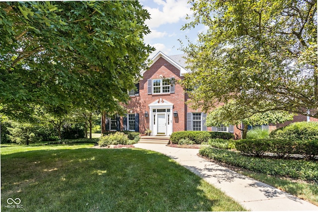 8552 E 550 S, Zionsville, IN 46077 - view of front facade featuring a front yard and brick siding
