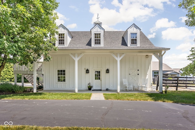 8552 E 550 S, Zionsville, IN 46077 - view of front of property with board and batten siding, covered porch, and roof with shingles