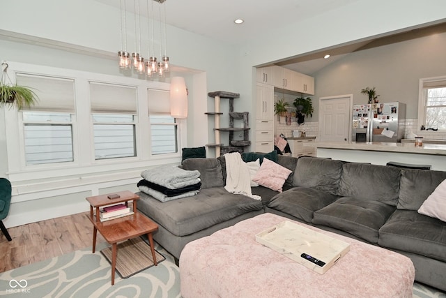 1719 Fletcher Ave, Indianapolis, IN 46203 - living room with lofted ceiling and light hardwood / wood-style floors