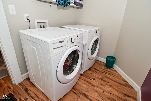 1719 Fletcher Ave, Indianapolis, IN 46203 - clothes washing area with hardwood / wood-style floors and washer and clothes dryer
