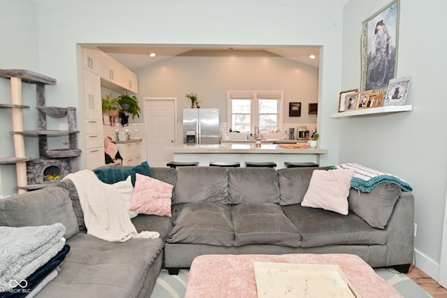 1719 Fletcher Ave, Indianapolis, IN 46203 - living room with lofted ceiling and light wood-type flooring