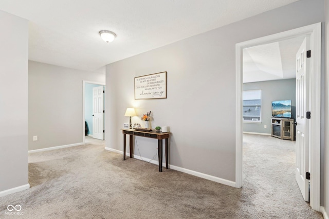 corridor with light colored carpet