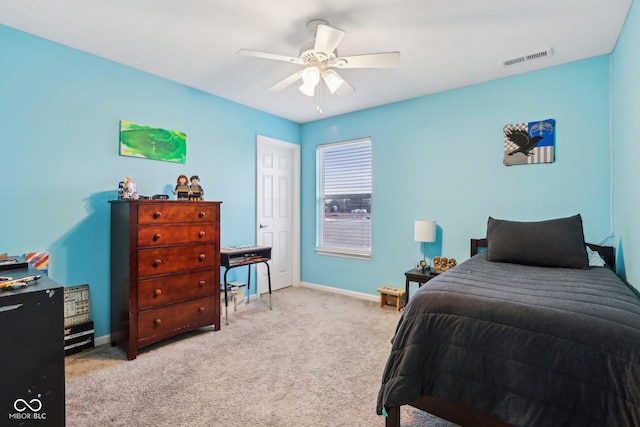 bedroom with light colored carpet and ceiling fan