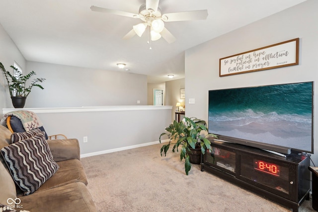 carpeted living room featuring ceiling fan