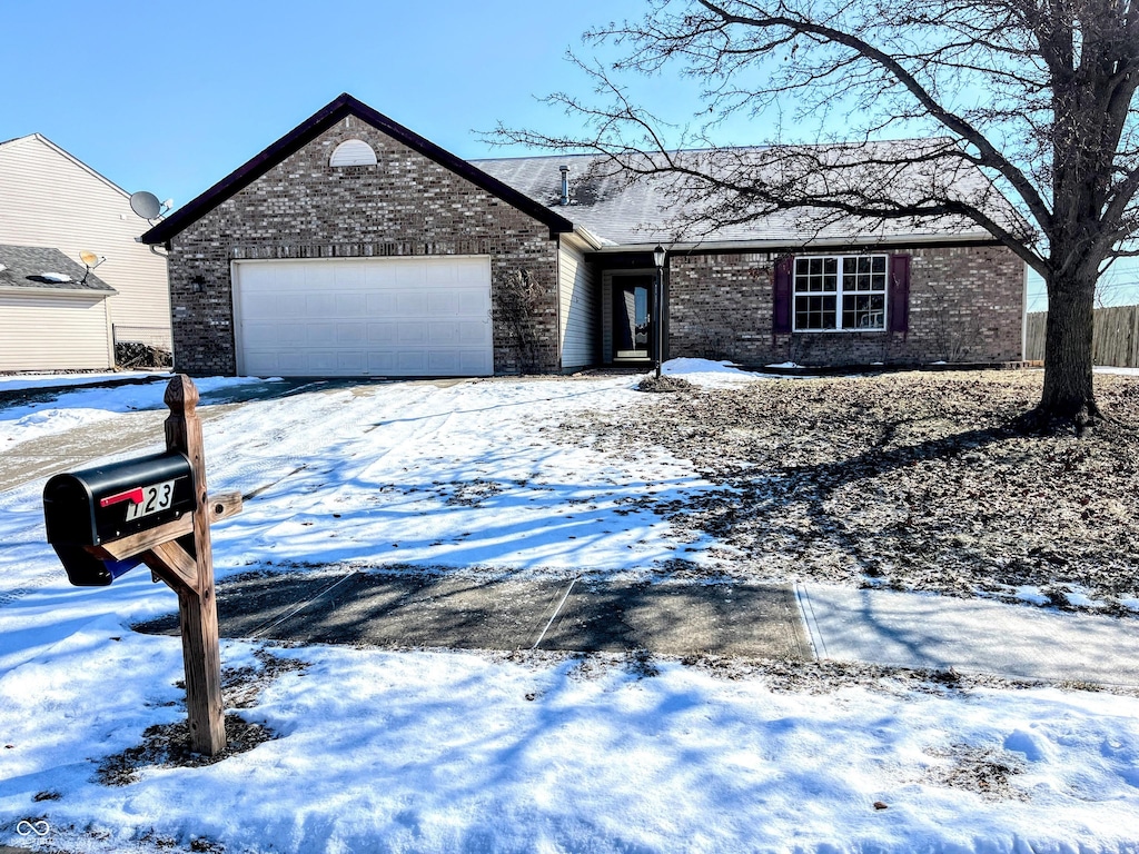 ranch-style home with a garage