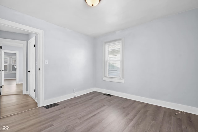 empty room featuring hardwood / wood-style flooring