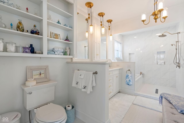 bathroom featuring an inviting chandelier, vanity, toilet, and a tile shower