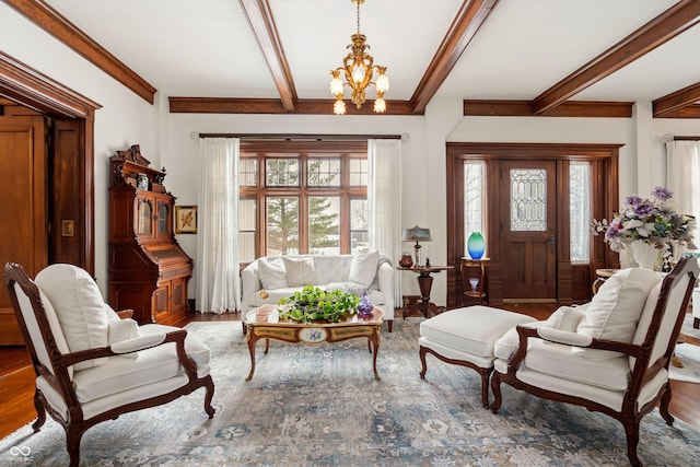 sitting room featuring hardwood / wood-style floors and a chandelier