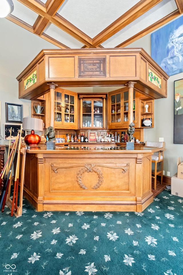 bar with beamed ceiling, coffered ceiling, and dark carpet