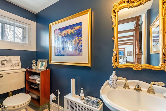 bathroom with sink and toilet