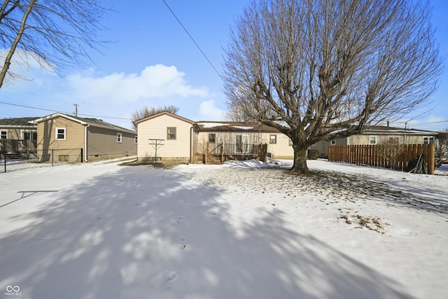 view of snow covered house