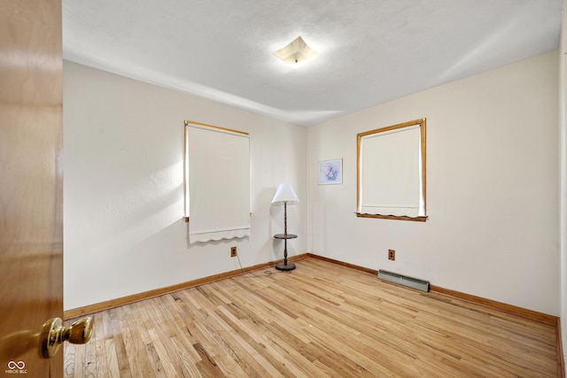 spare room featuring light wood-type flooring