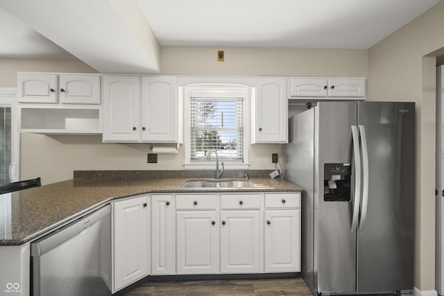 kitchen with white cabinetry, sink, dark wood-type flooring, and appliances with stainless steel finishes