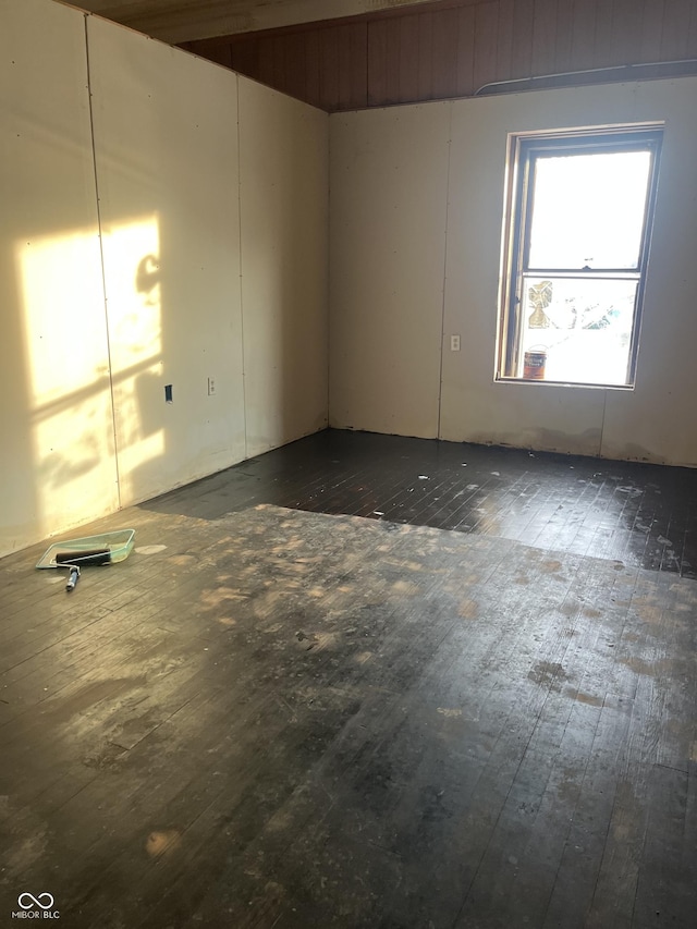 empty room featuring dark wood-type flooring