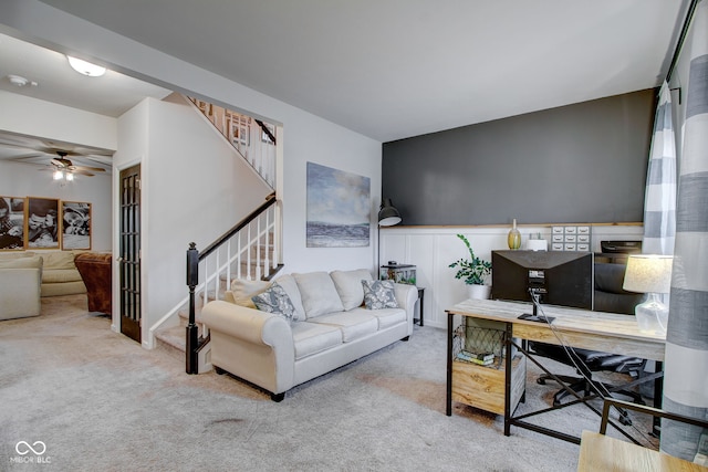 living room with light carpet and ceiling fan