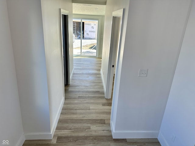 hallway featuring light wood-type flooring