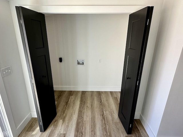 corridor featuring light hardwood / wood-style floors