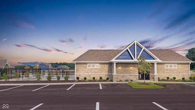 view of outdoor building at dusk