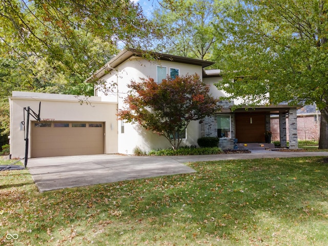 view of front of property featuring a garage and a front yard