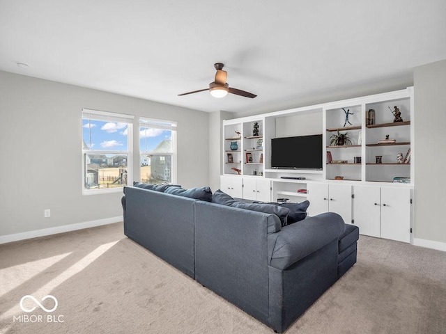 living room with ceiling fan and light carpet