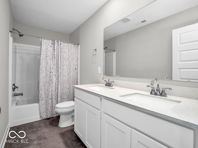 full bathroom with shower / tub combo with curtain, vanity, toilet, and tile patterned flooring