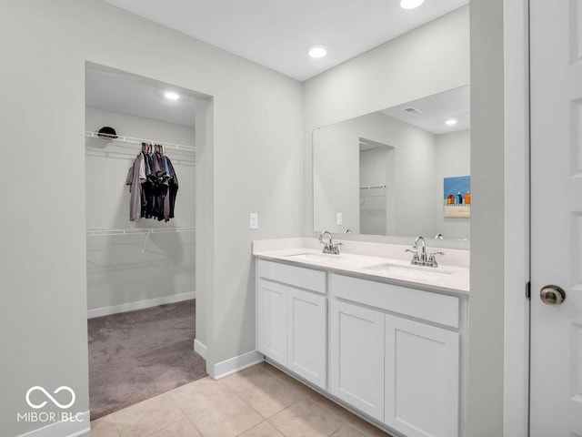 bathroom with vanity and tile patterned floors