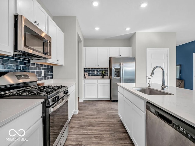 kitchen featuring white cabinetry, stainless steel appliances, and sink