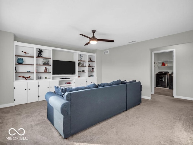 living room featuring light carpet and ceiling fan