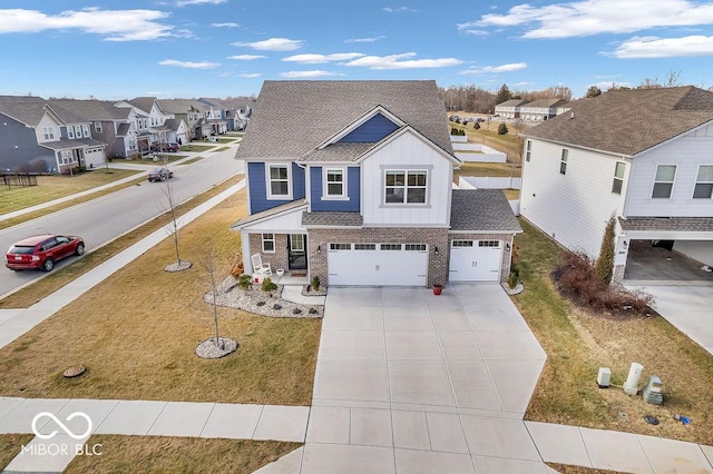 view of front of home with a garage and a front yard